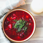 Borscht, beet soup in white bowl