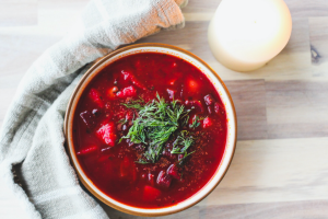 Borscht, beet soup in white bowl