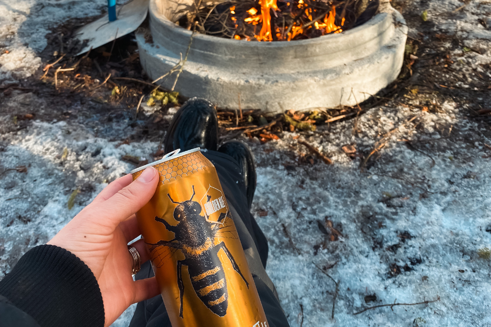 Little Brown Jug beer by a bonfire