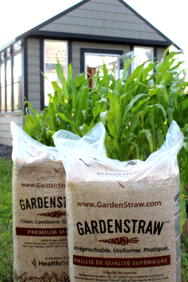 Bags of HealthiStraw garden mulch
